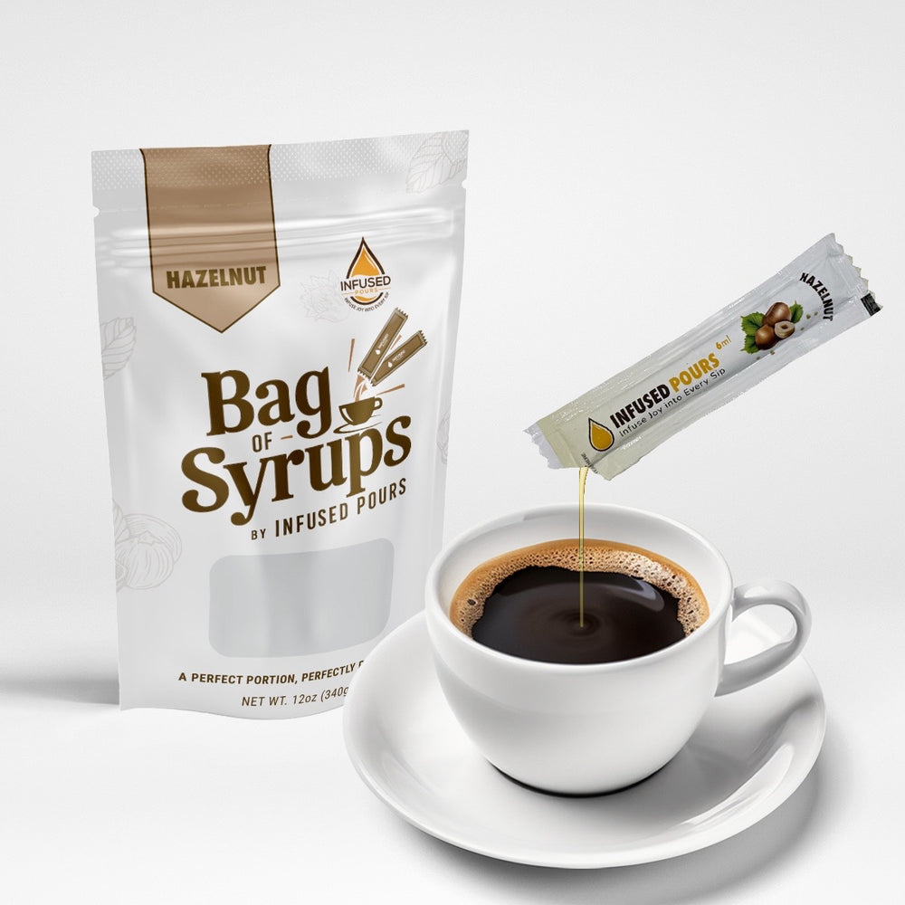 Bag of hazelnut syrup packets pouring into a coffee cup